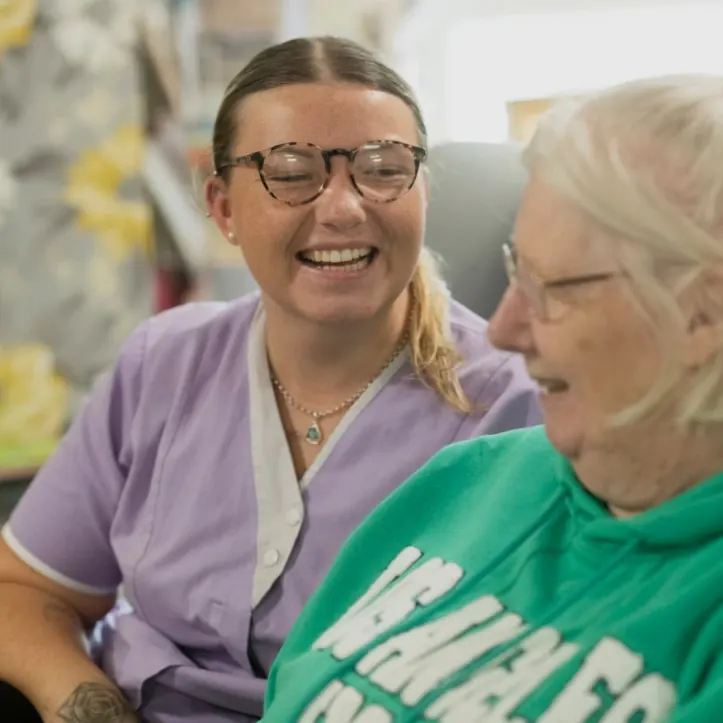 A nurse talking with an older woman.